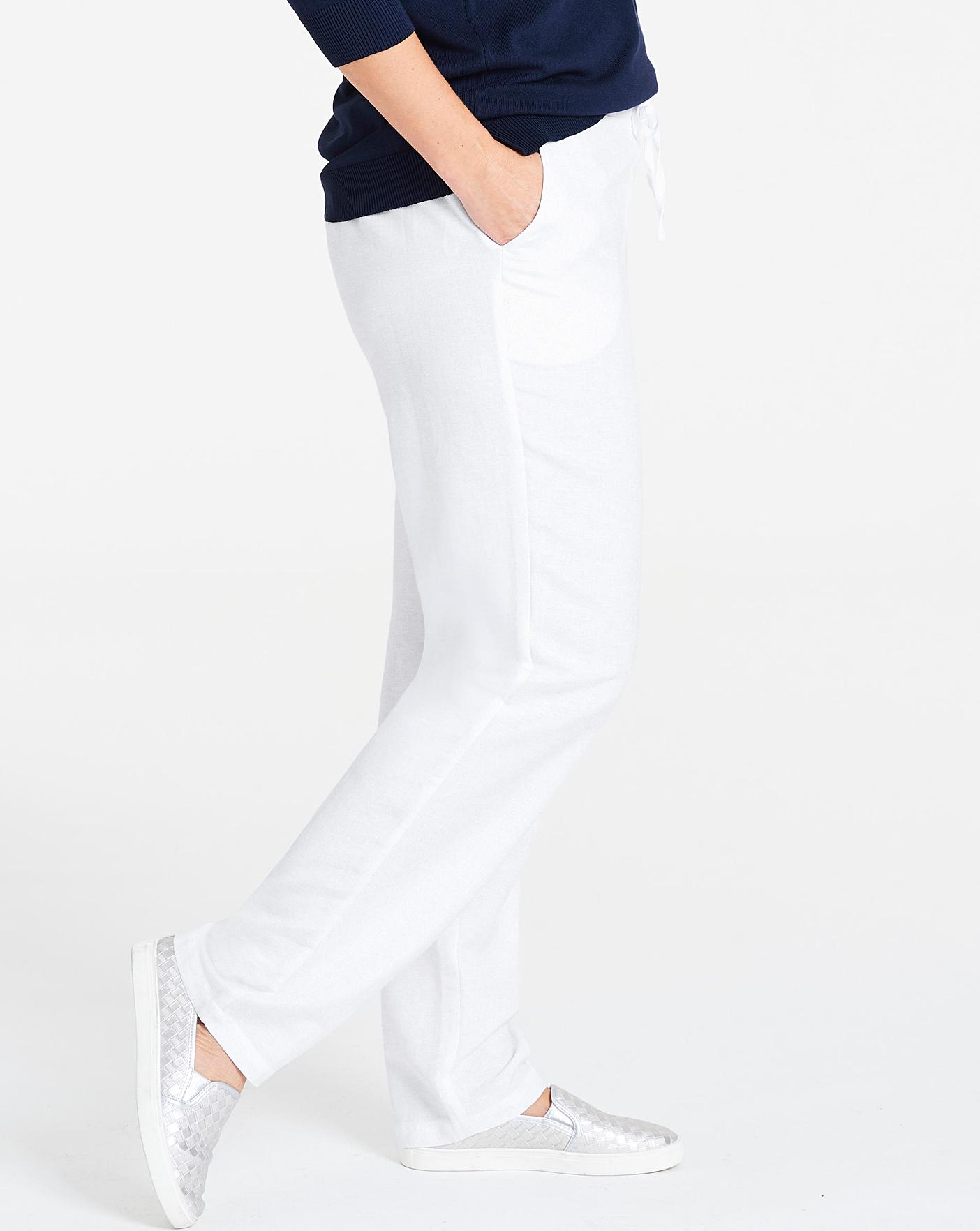 white tapered linen trousers