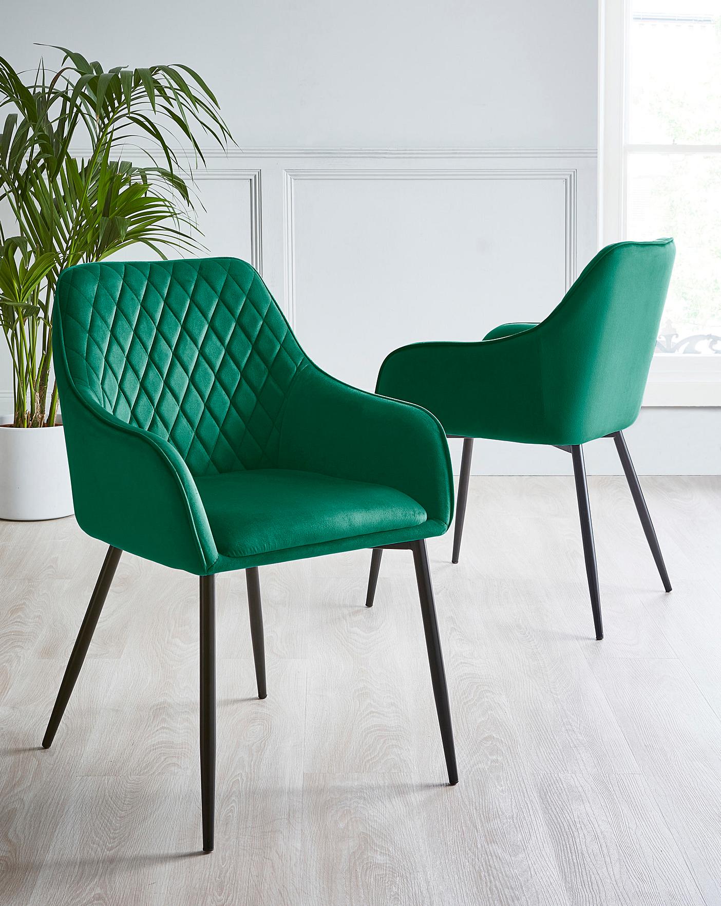 pair of dining chairs with arms