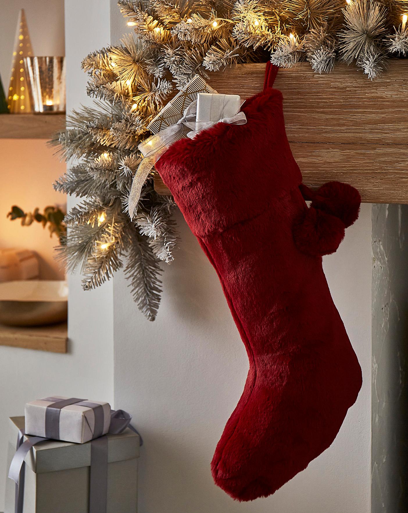 red christmas stocking with faux fur