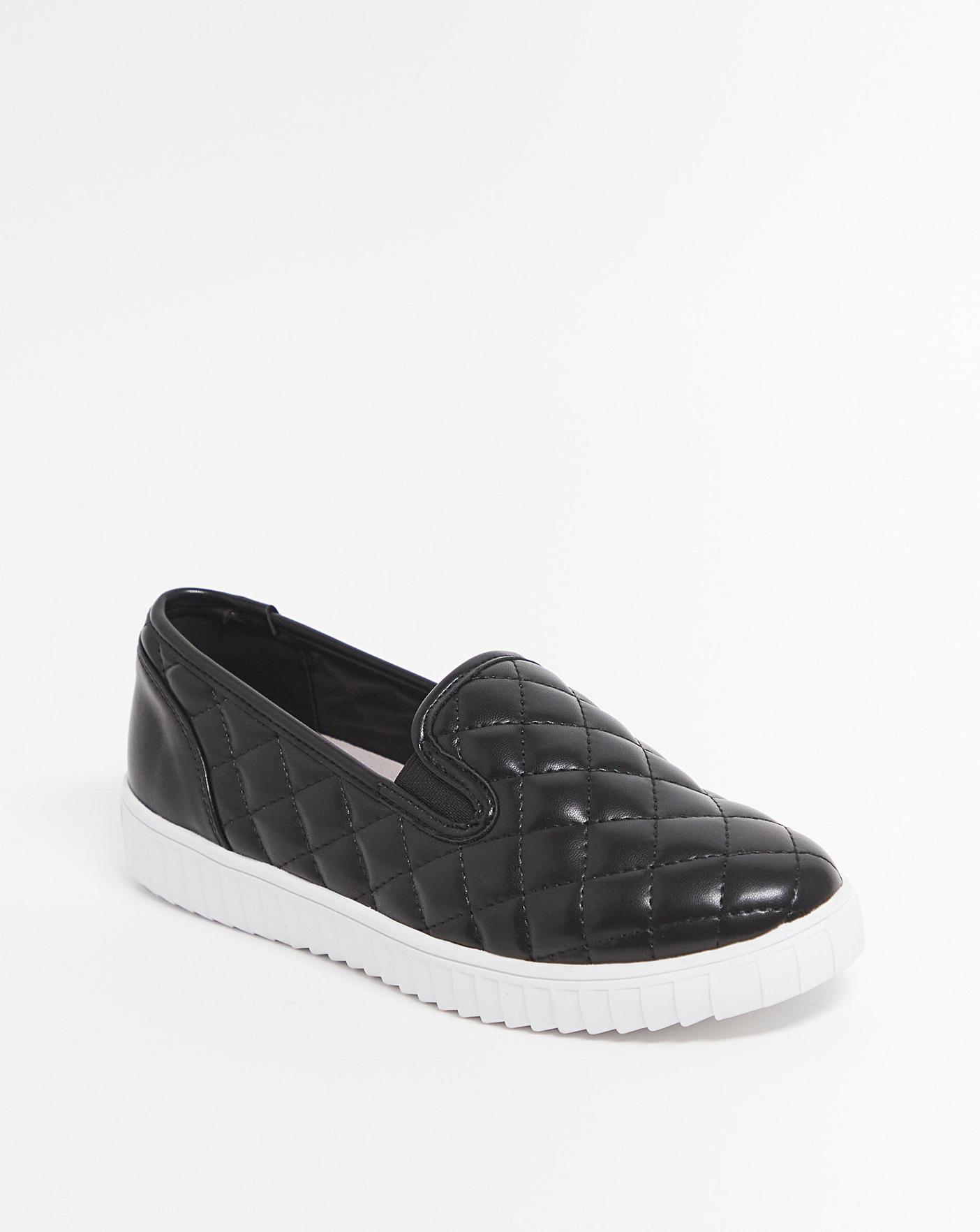 Womens black quilted hot sale slip on shoes