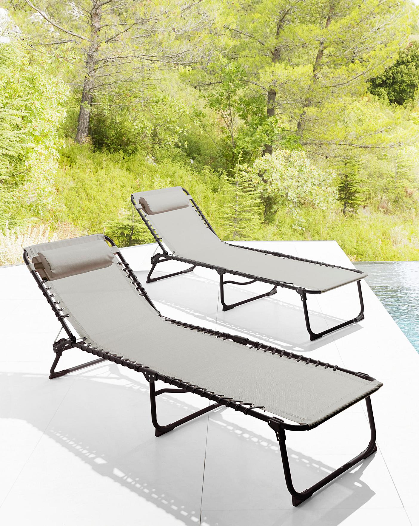 pair of zero gravity sun loungers