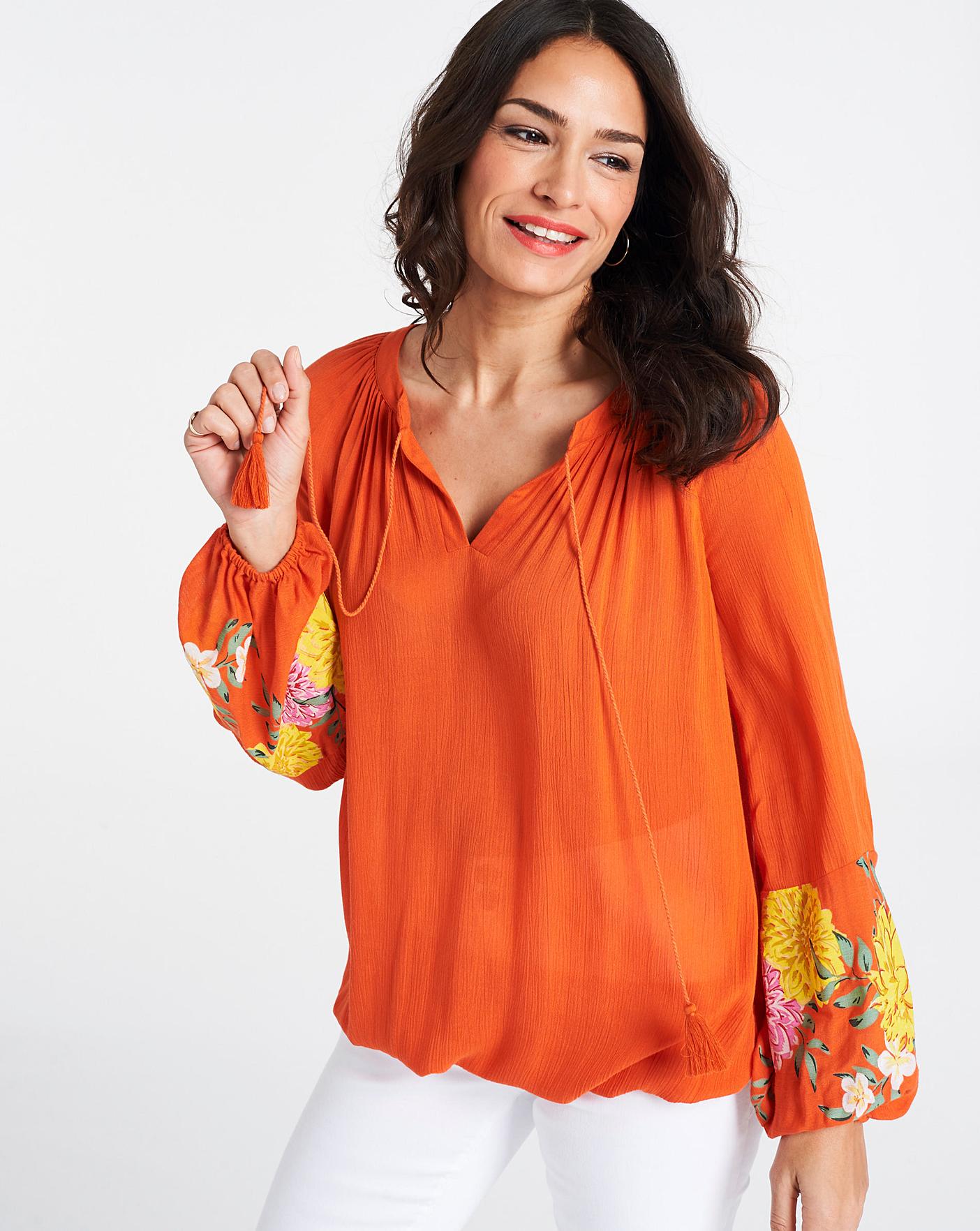 orange peasant top