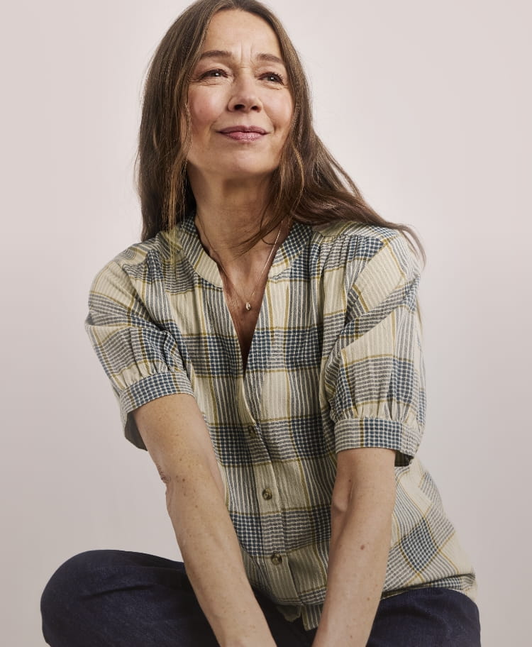 Model wearing a check blouse