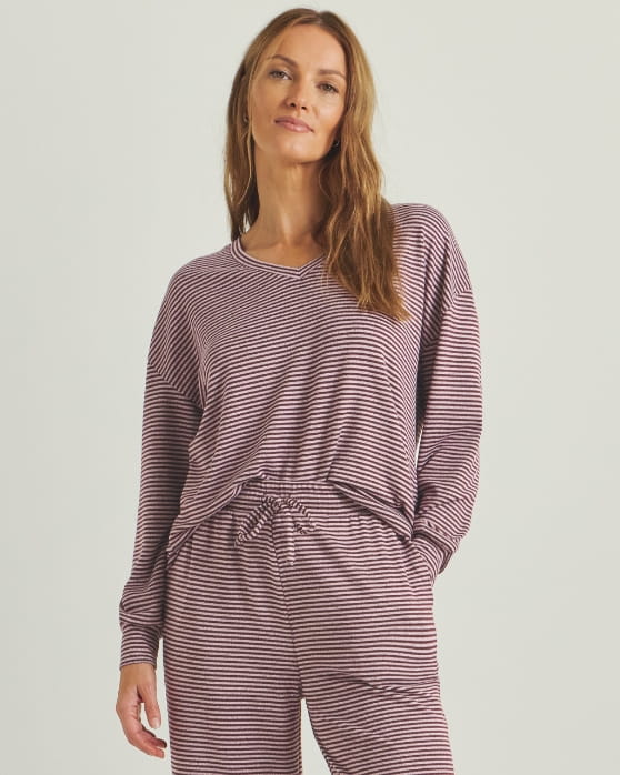 A model wearing a pink Pretty Secrets soft knit lounge set