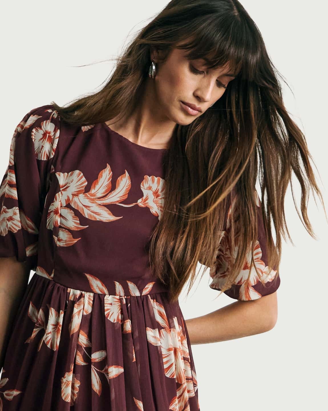 Model wearing a Joanna Hope Lace Back Midi Dress.